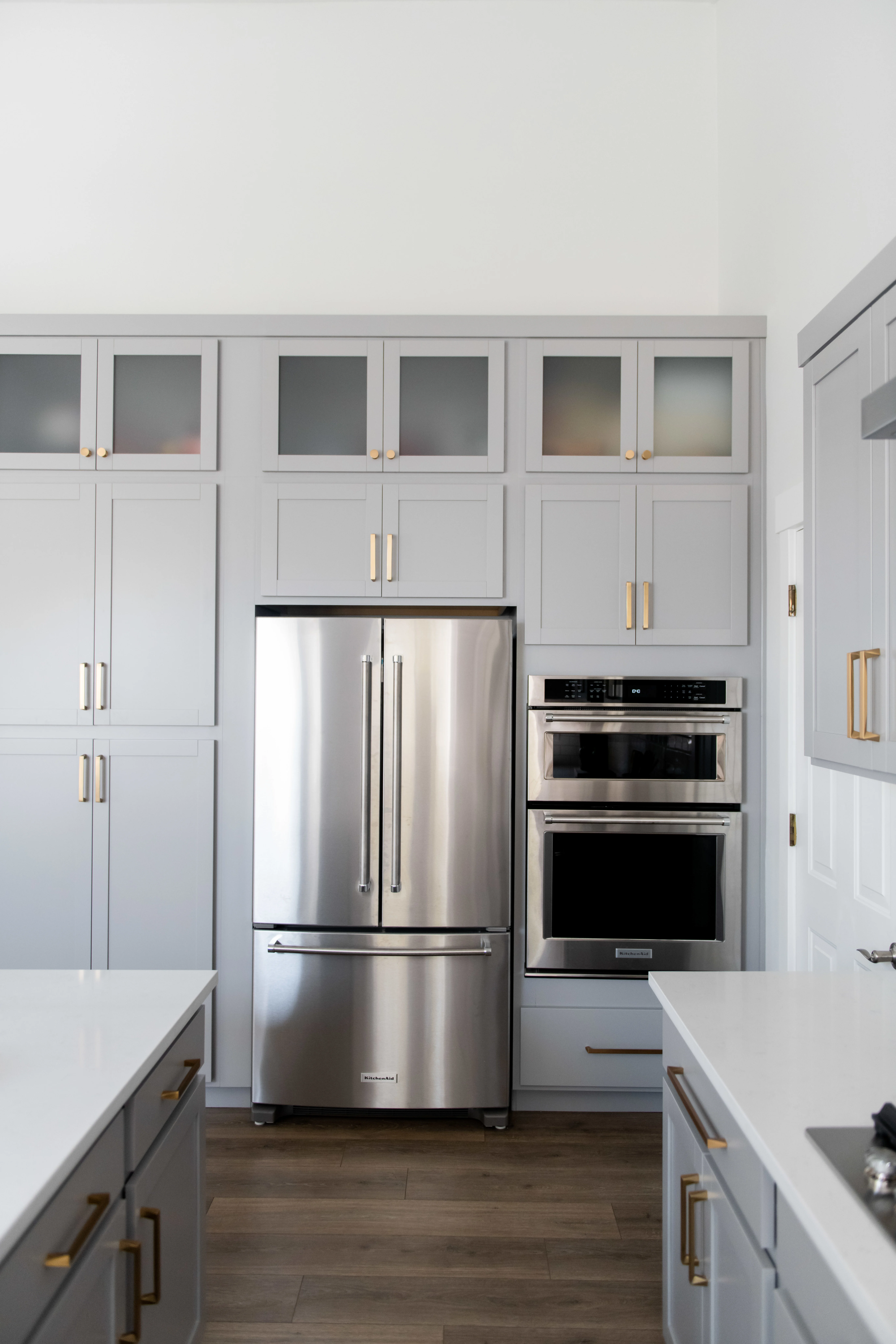 Kitchen fridge, oven, and cabinets