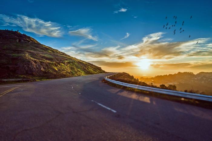 Winding road next to sunrise