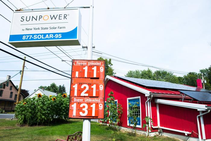 SunPower by New York State Solar Farm renovated this 1960s gas station site into a new solar sales office.