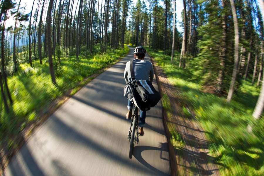 Riding a bicycle instead of driving keeps harmful carbon dioxide out of the atmosphere.