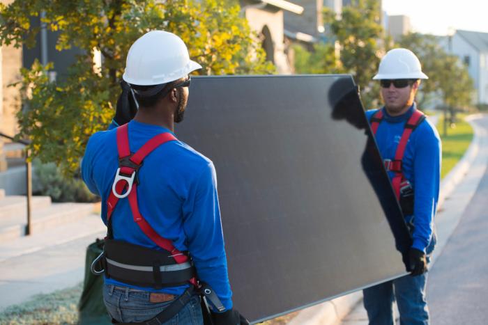 Dealer installing SunPower panels on home