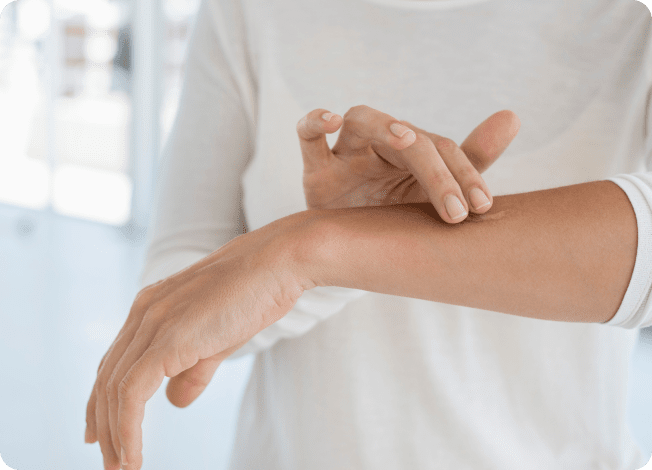 Person applying antibiotic ointment on their arm