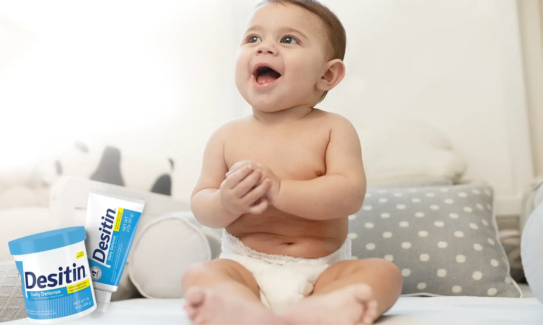 Desitin® Daily Defense Collection, a baby radiantly smiling when looking around
