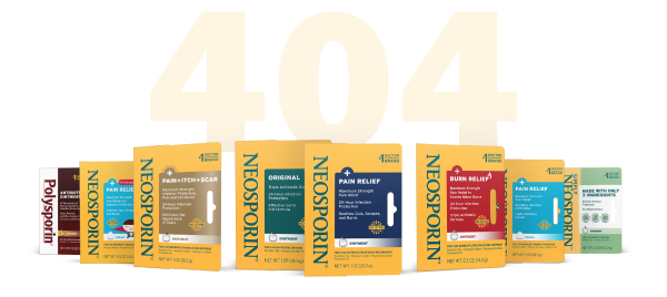 Neosporin product line displayed in front of a large '404' sign, including original, pain relief, burn relief, and scar treatment varieties.
