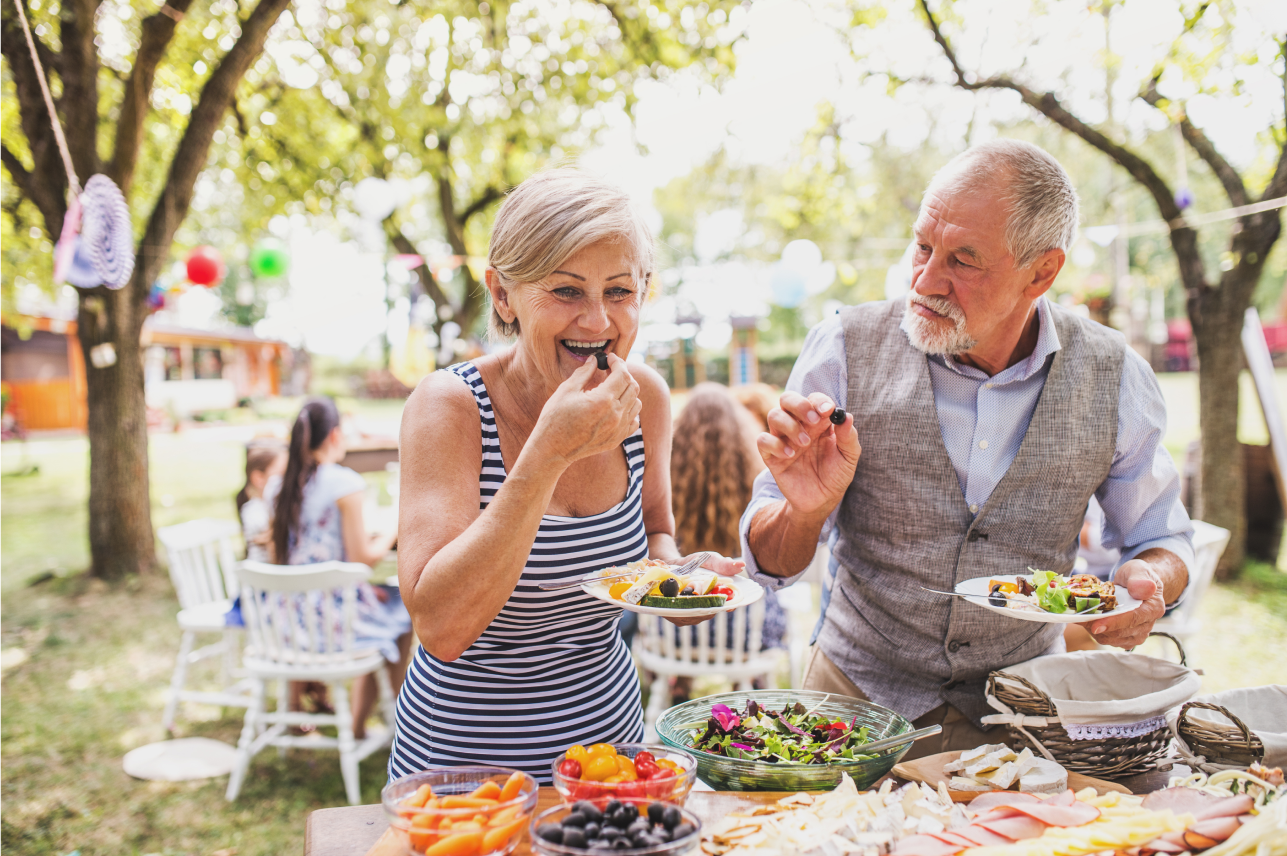 Elderly couple enjoying breakfast table with Imodium.