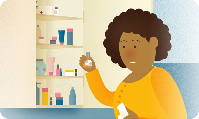 Woman looking at medicine from cabinet