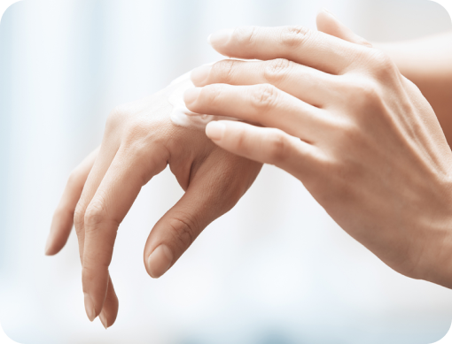 Person applying NEOSPORIN ointment to knuckles