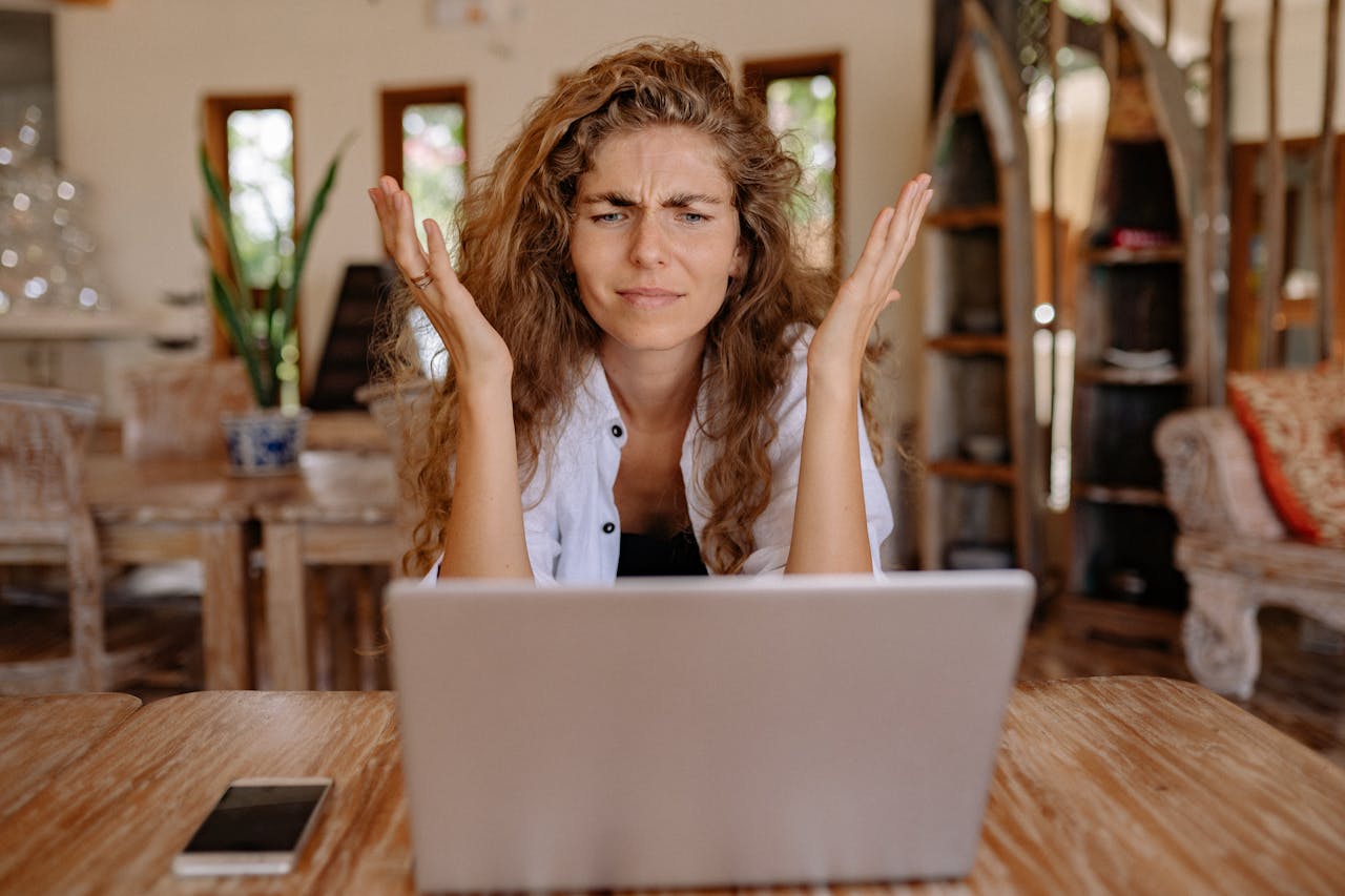 Confused Business Owner With Laptop