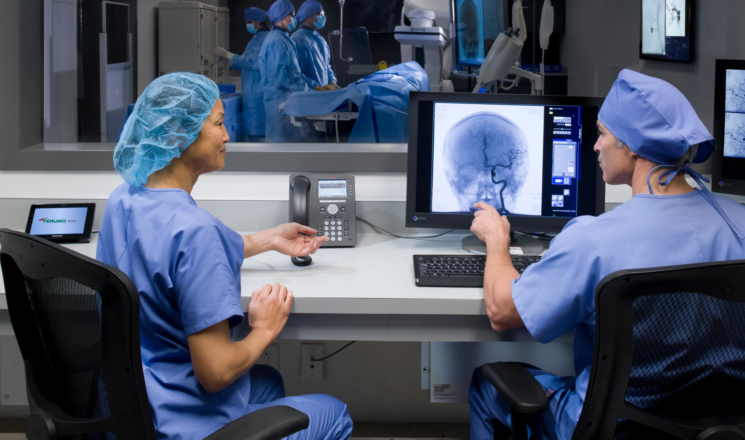 Doctors reviewing screen