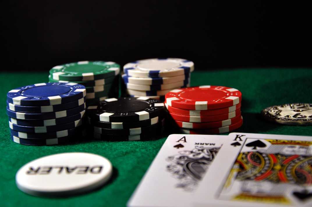 Poker chips and cards on a poker table.