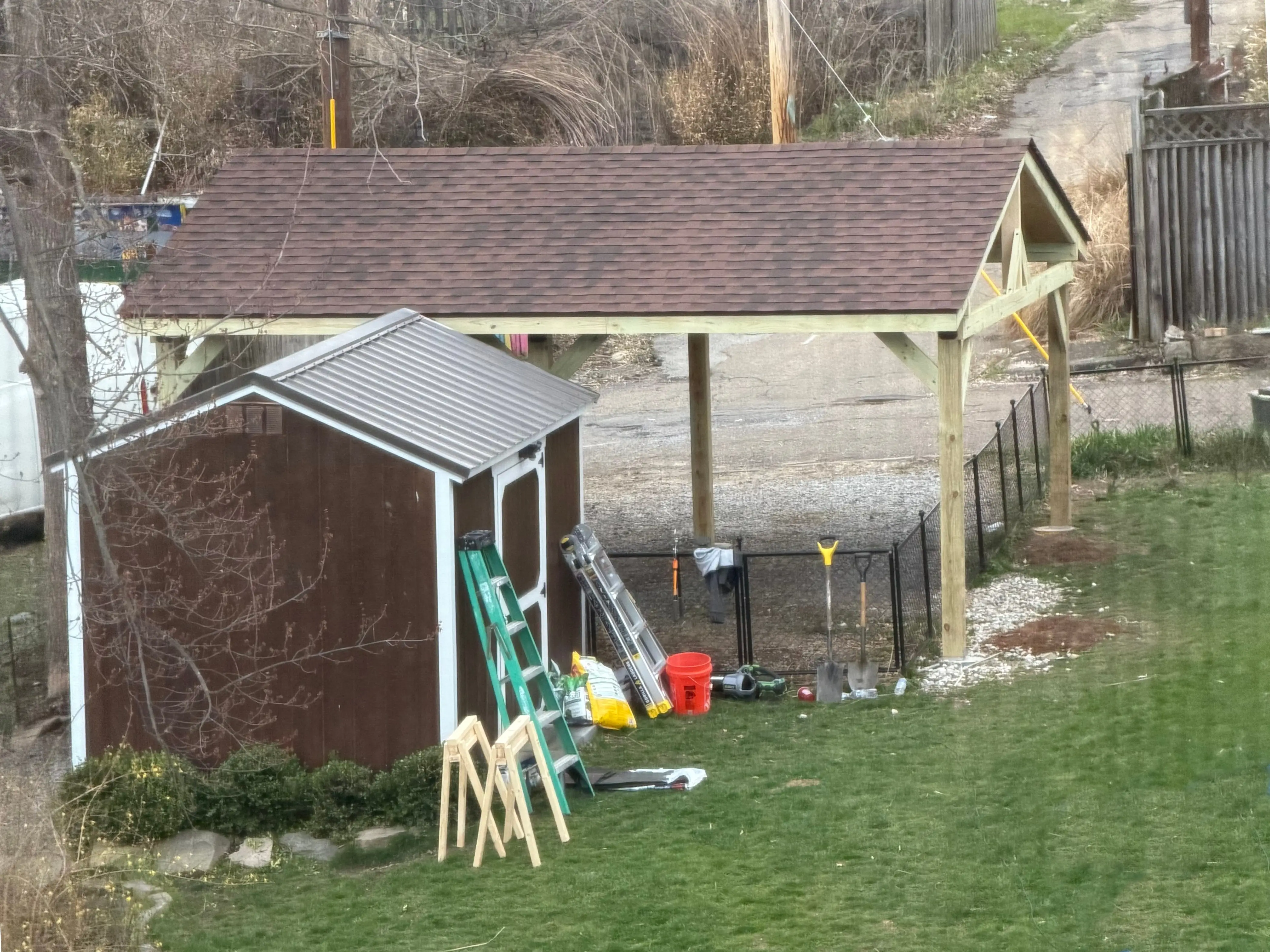 Side view of the detached garage pavilion, with existing shed for scale. Side view of the detached garage pavilion, with existing shed for scale.