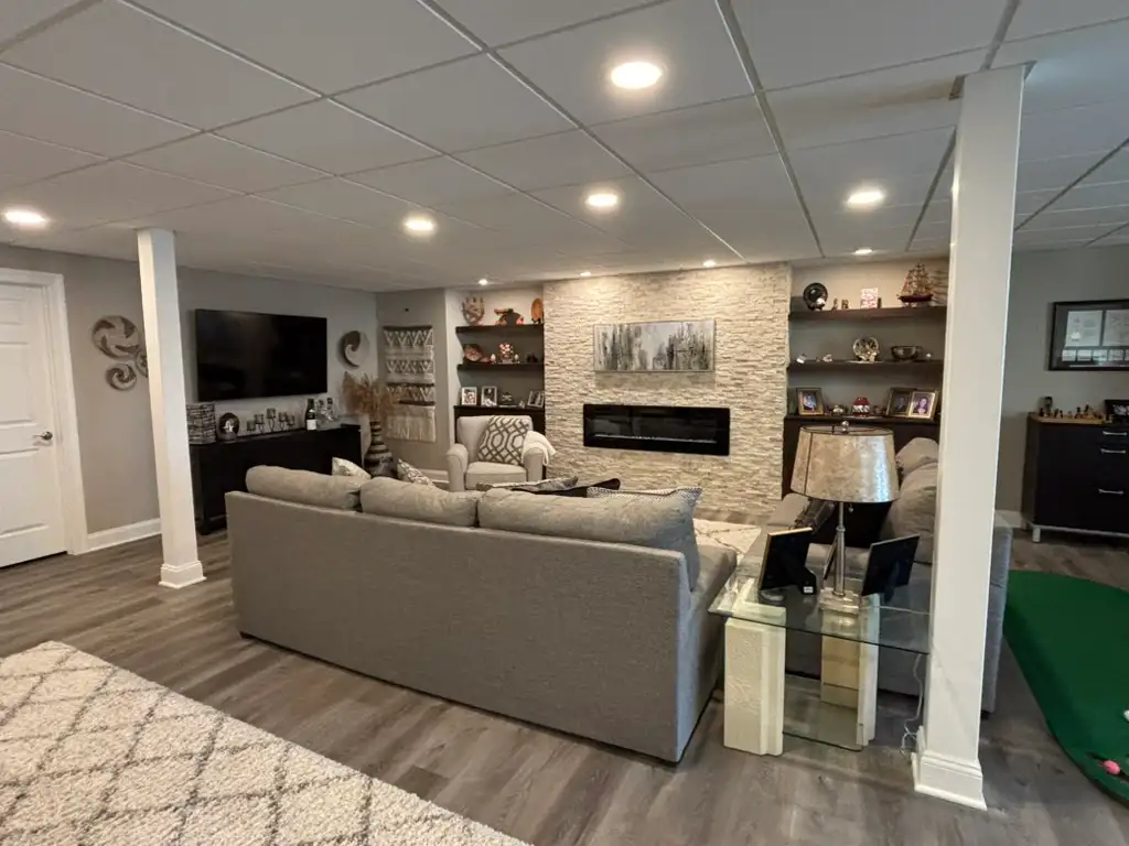 Denville NJ Basement 1 - Completed - Wide view of new basement space including fireplace Denville NJ Basement 1 - Completed - Wide view of new basement space including fireplace