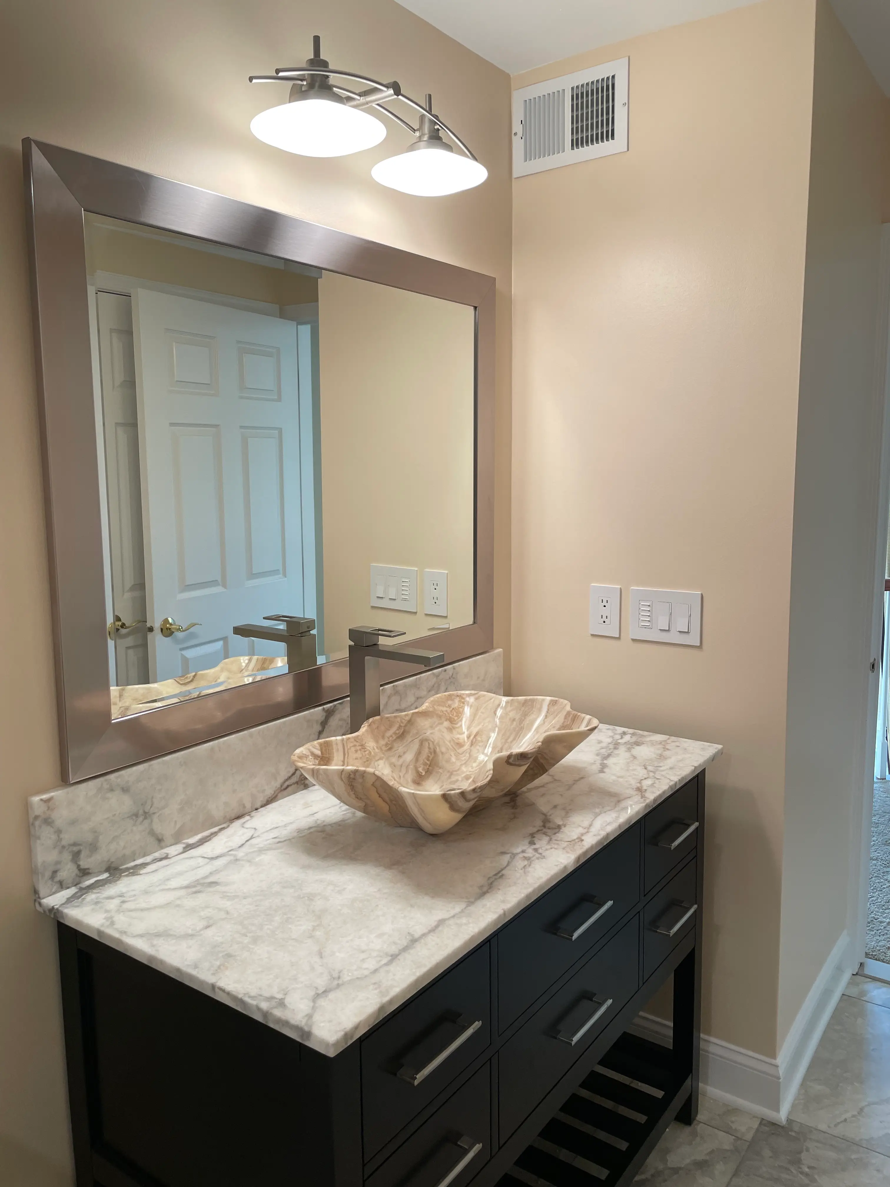 Denville NJ Bathroom 1 - Completed - Detail view of extra large mirror, quartzite countertop and custom carved sink Denville NJ Bathroom 1 - Completed - Detail view of extra large mirror, quartzite countertop and custom carved sink