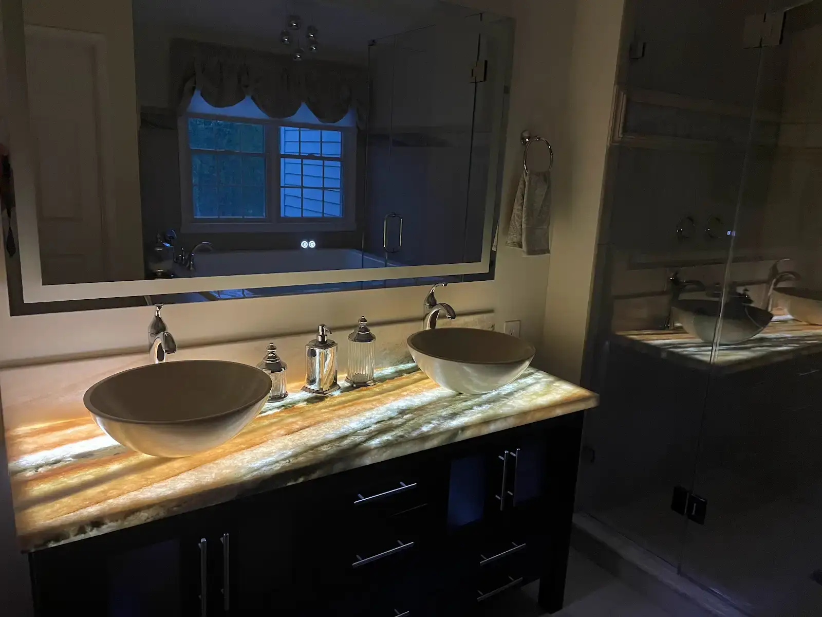 Denville NJ Bathroom 4 - Completed - Underlit vanity with Medusa Quartzite countertop, double sinks and large lit mirror Denville NJ Bathroom 4 - Completed - Underlit vanity with Medusa Quartzite countertop, double sinks and large lit mirror