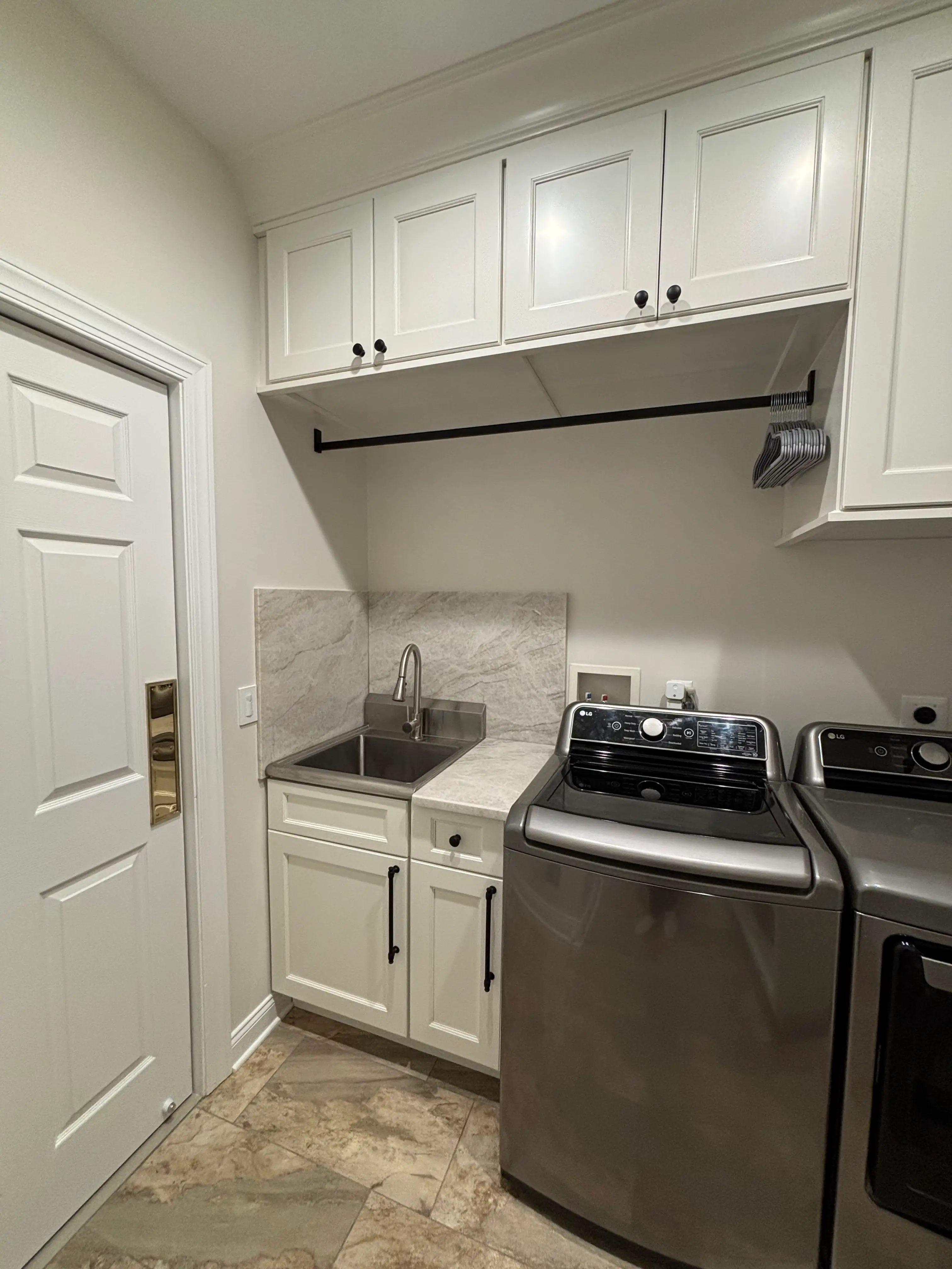 Denville NJ Laundry Room - Phase 2 - New cabinets, clothes rod, swinging door, and Taj Mahal quartzite countertops Denville NJ Laundry Room - Phase 2 - New cabinets, clothes rod, swinging door, and Taj Mahal quartzite countertops