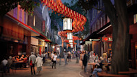 A lively urban street scene at night shows people dining and walking under red lanterns and large hanging lights in an outdoor pedestrian area.