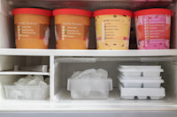 Freezer full of ice cream containers
