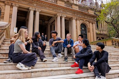 Participants from our youth opportunities program sitting on Town Hall steps. 