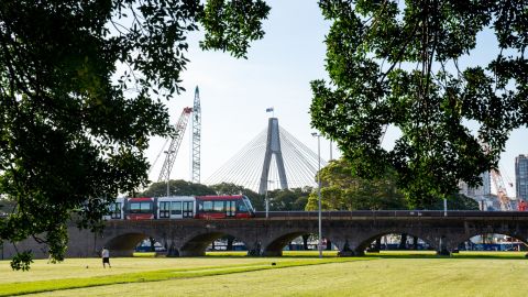 (22 March 2022) Light rail with the Anzac Bridge in the background. (Photo by Abril Felman/City of Sydney)