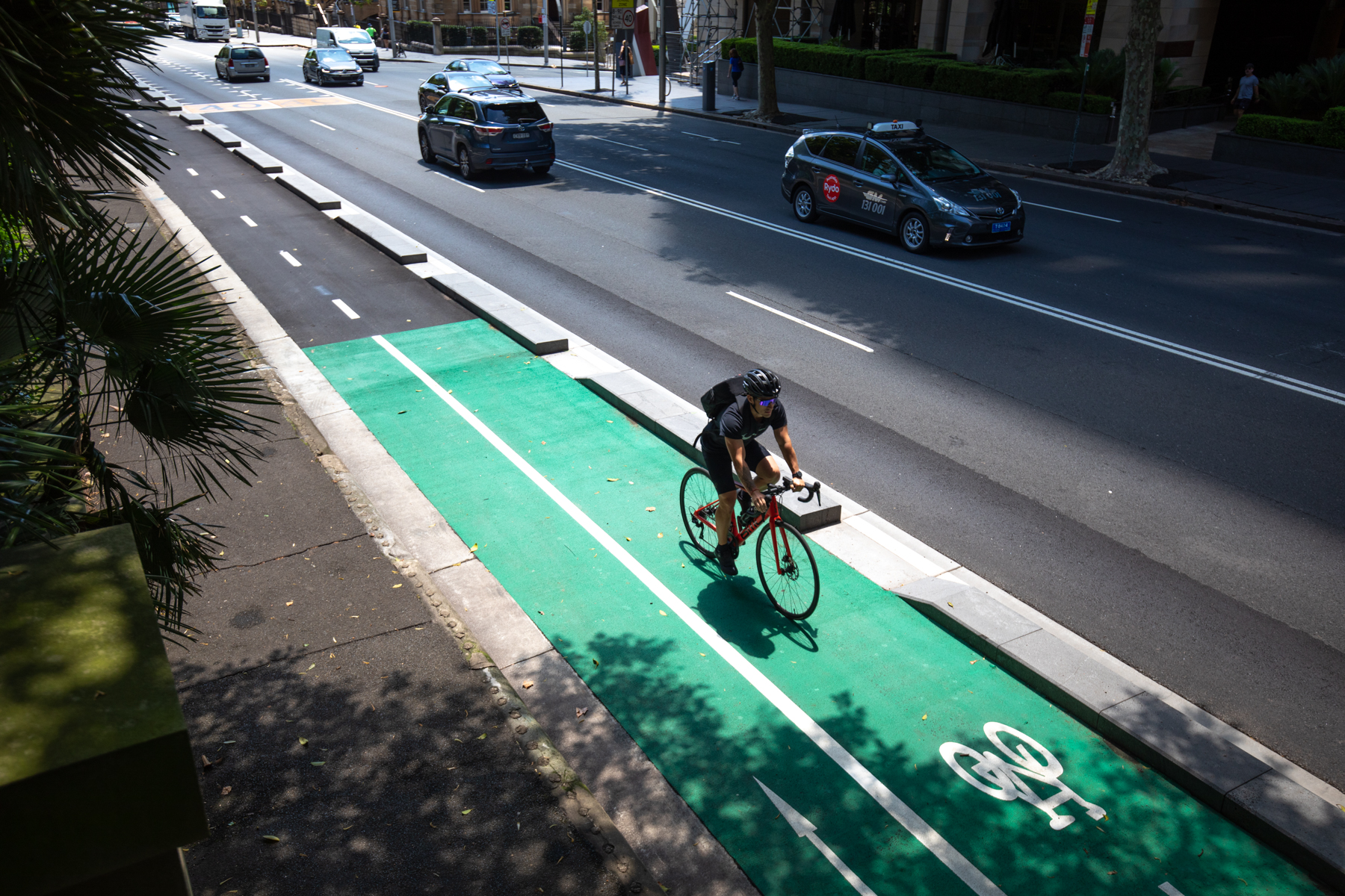 The separated bi-directional cycleway runs alongside leafy Hyde Park. 