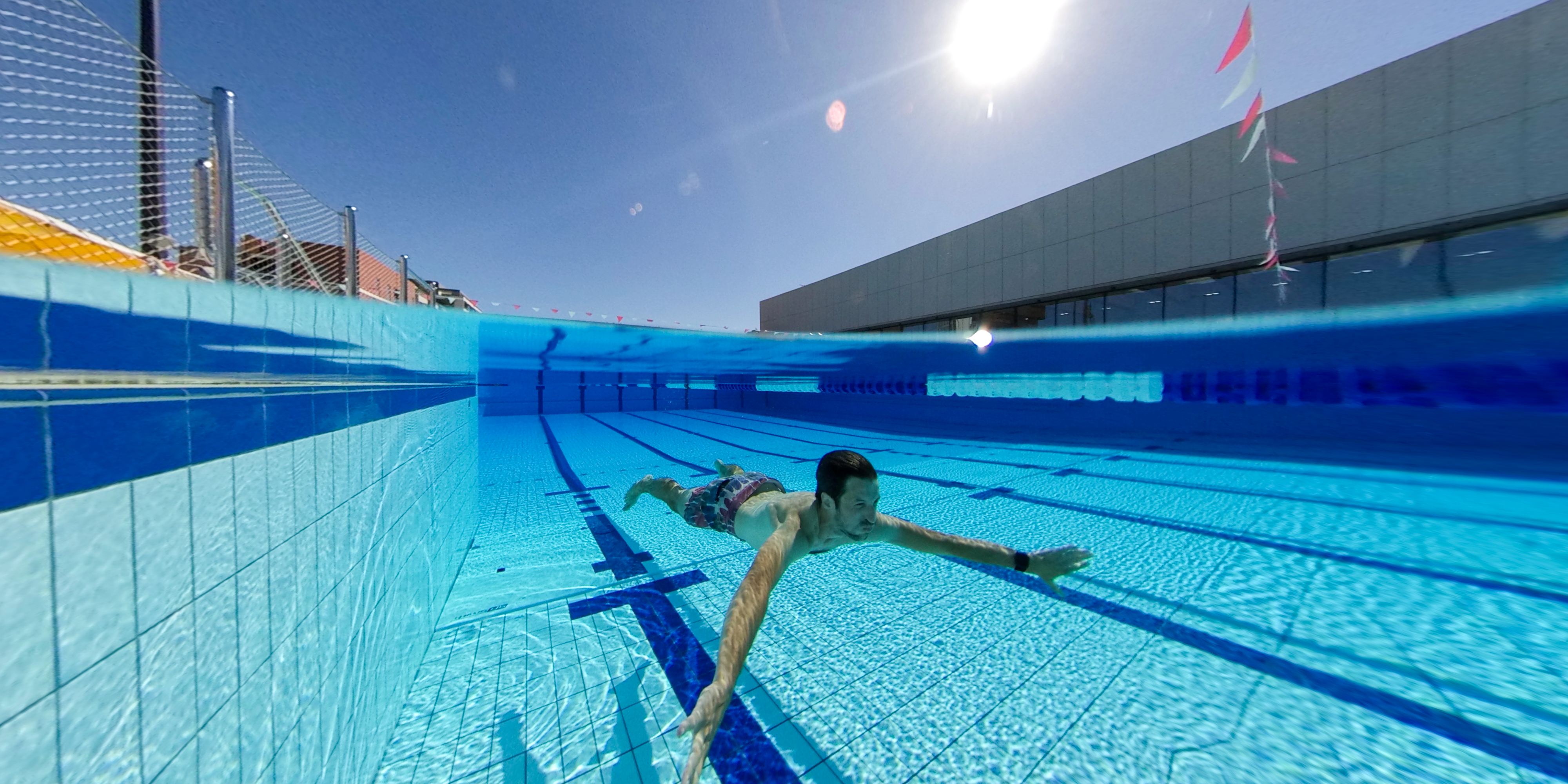 The glistening 50-metre outdoor pool.