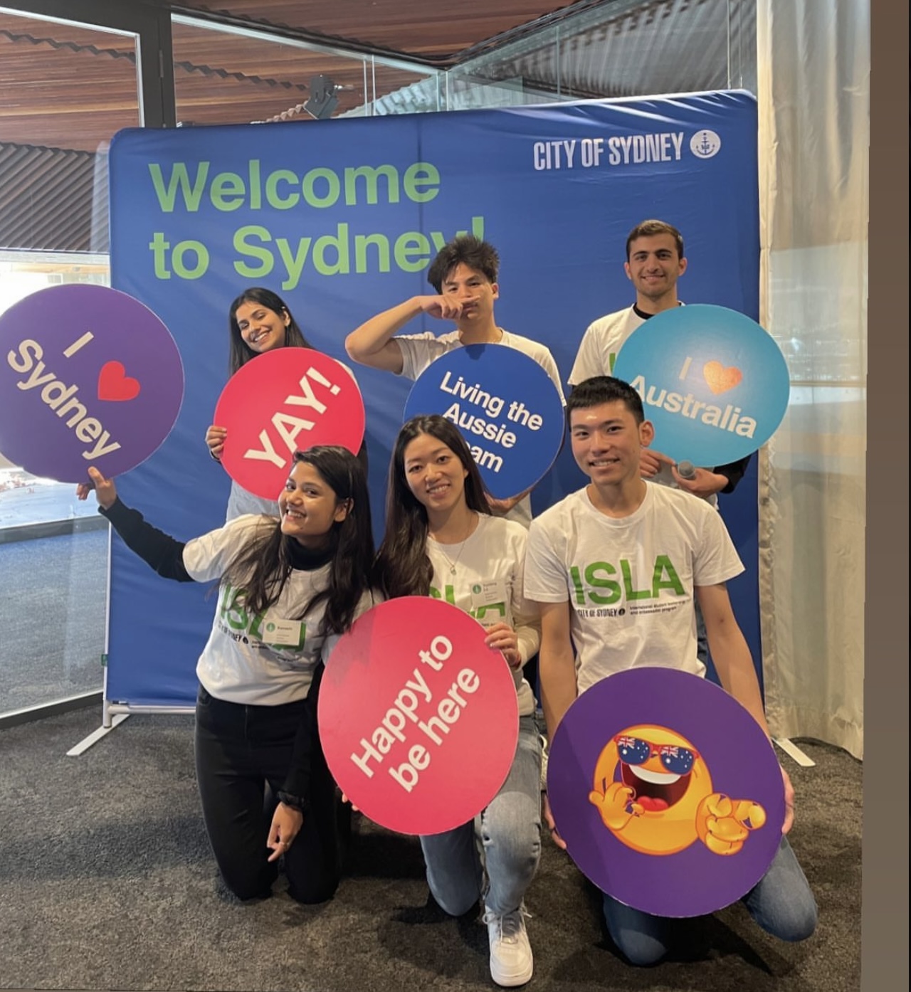 Kamashi (bottom right) and other international student ambassadors prepare for an event. Image: supplied by Kamashi