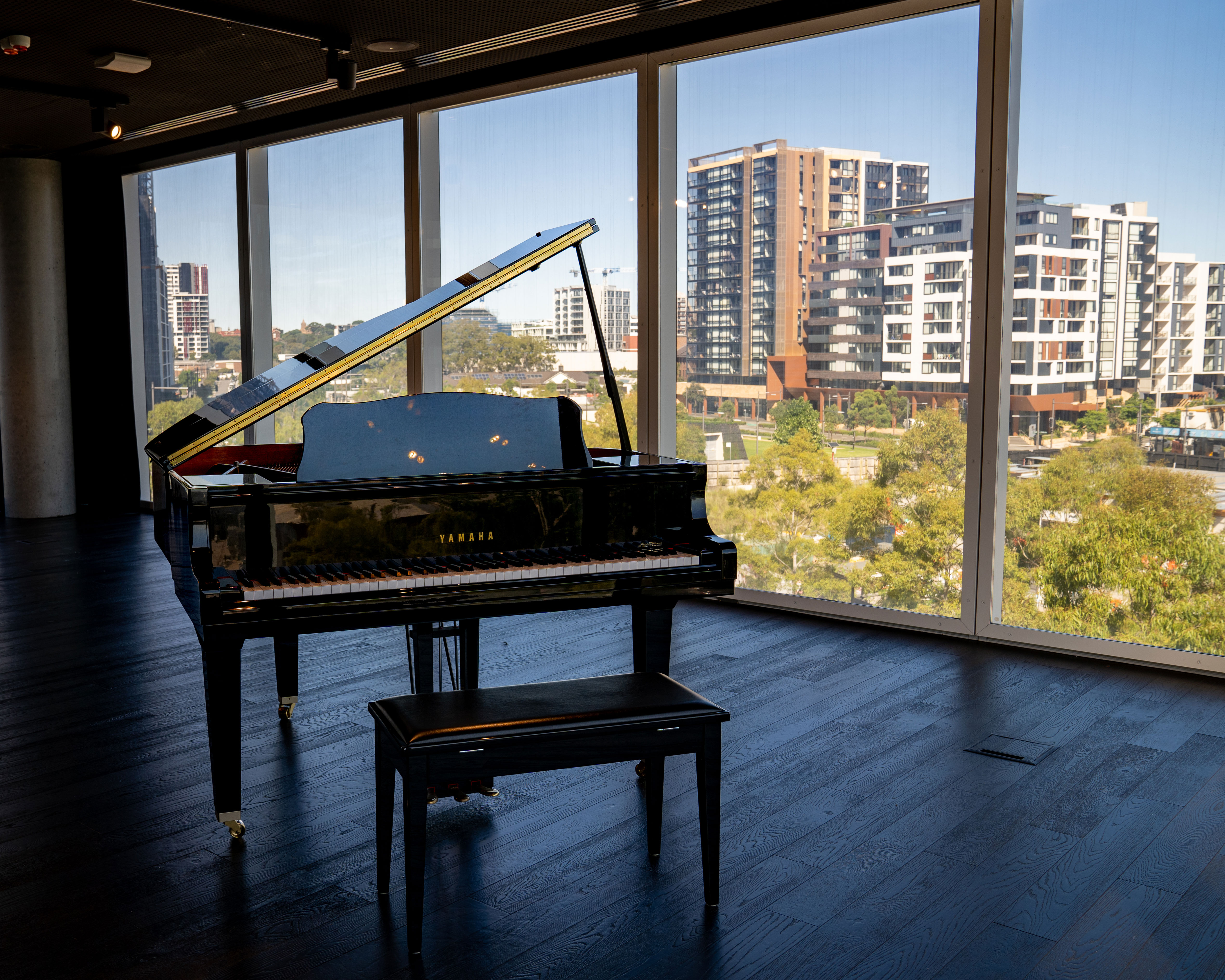 Take a seat at the baby grand piano