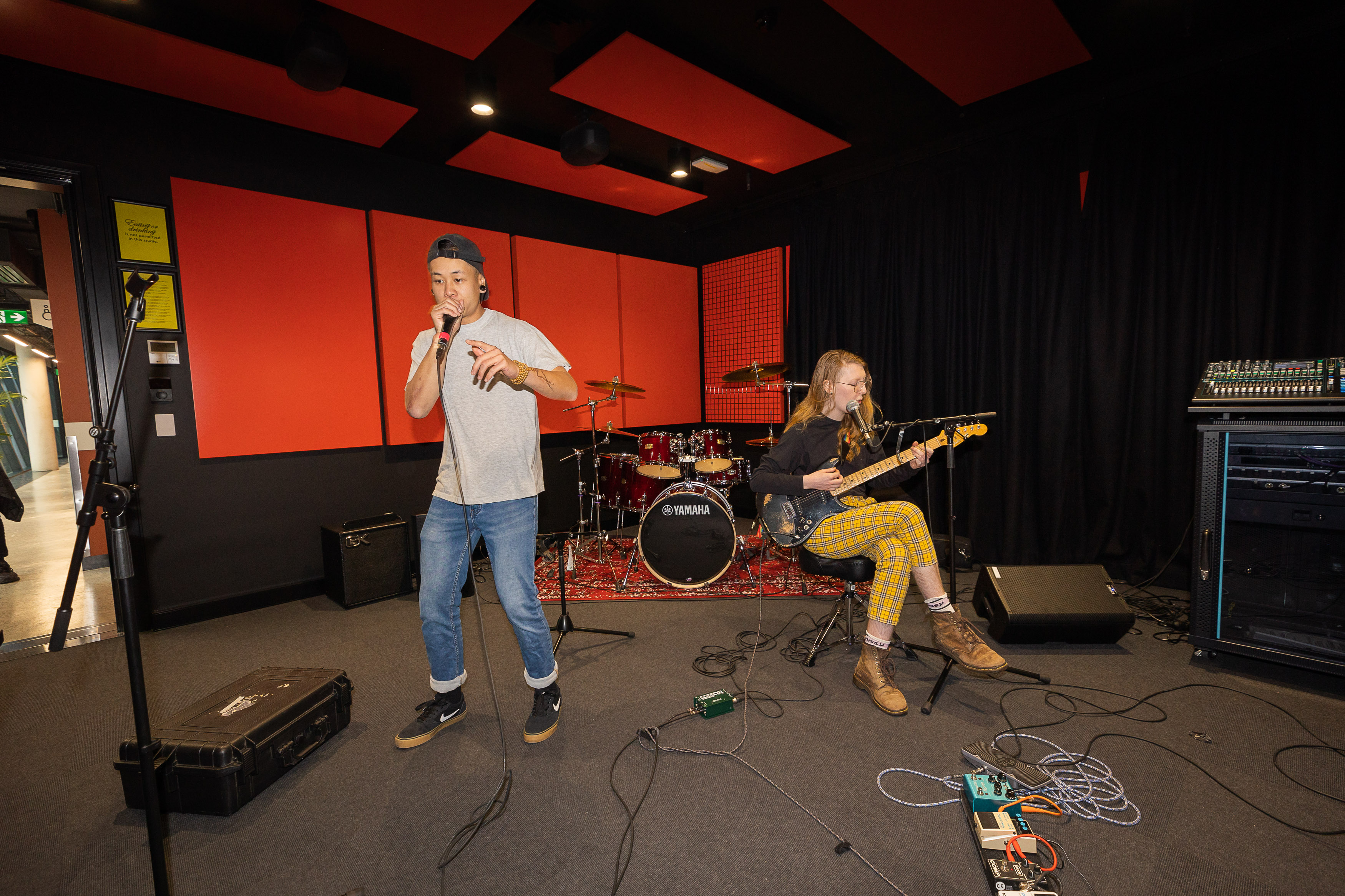 A singer and guitarist rehearsing in the studios. Photo: Matt Lambley