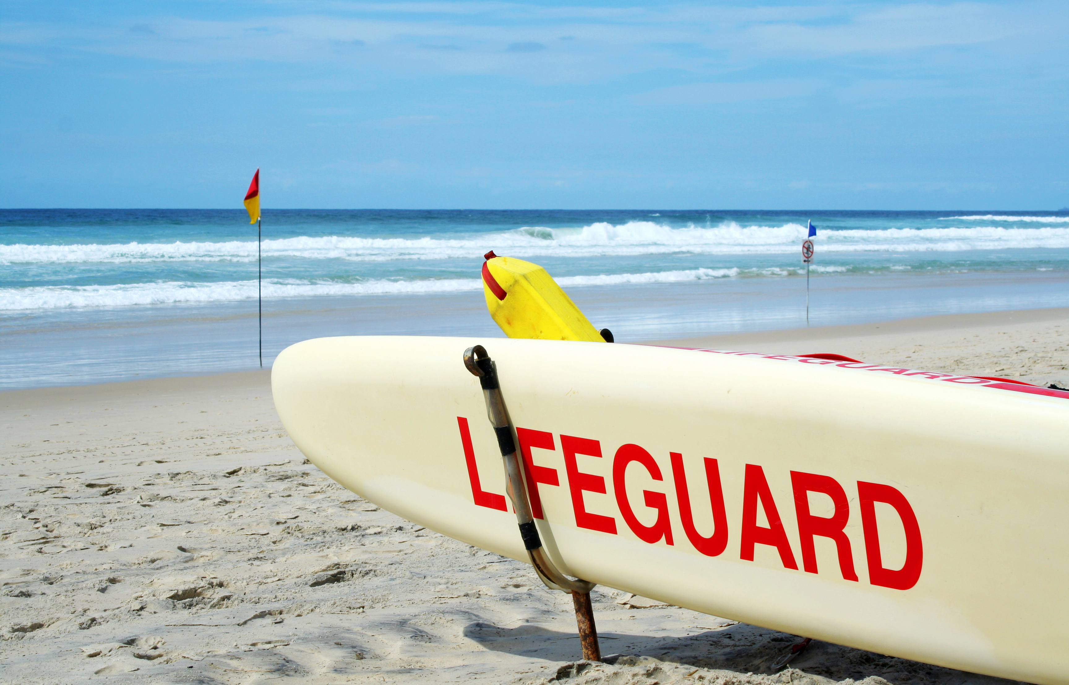 Always swim at a beach patrolled by lifeguards and between the red and yellow flags. Photo: Getty Images