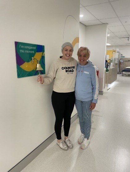 Tarryn pictured ringing the Captain’s Bell at the end of her treatment .