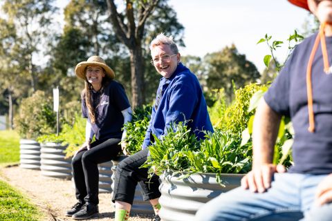 Jez Wick and Belinda Thackeray with some of the farm&#39;s raised beds. Everything is grown above ground or is grafted to dwarf root stock, to avoid deep roots piercing the clay cap installed over the former tip site below. Photo: Chris Southwood, City of Sydney.