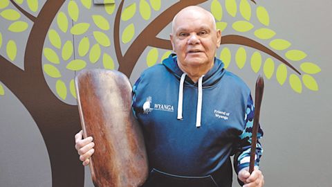 Elvis at Wyanga with handcrafted coolamon and bundi stick. Photo by Vicky Haines.