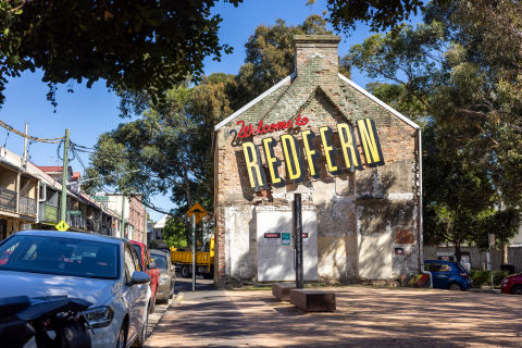 The &#39;Welcome to Redfern&#39; mural by Reko Rennie Rennie and young local Aboriginal artists in 2013.