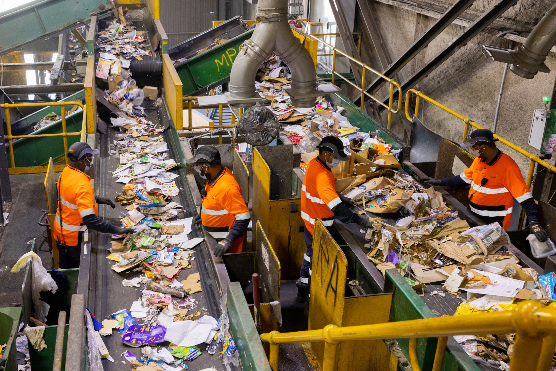 Our teams sorting items at the recycling facility. Image: Chris Southwood.