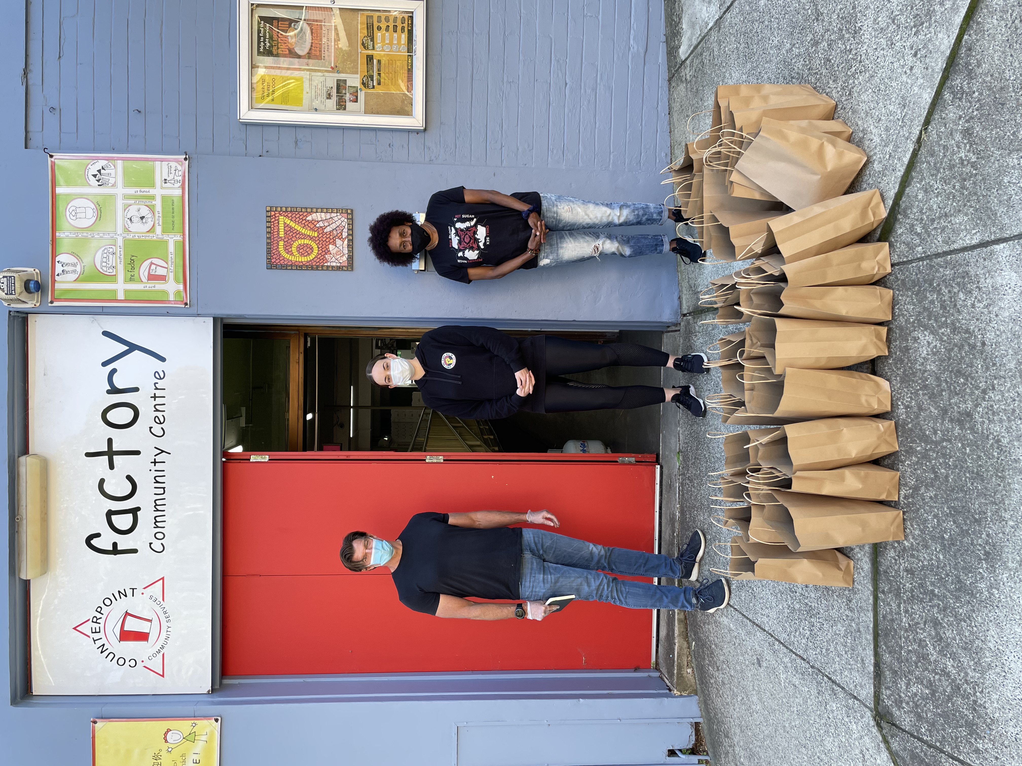 Alasdair Grant from Viral Kindness with Coral Lever and Elley Meadows from First Nations Covid-19 Response distribute hampers from the Factory Community Centre in Waterloo