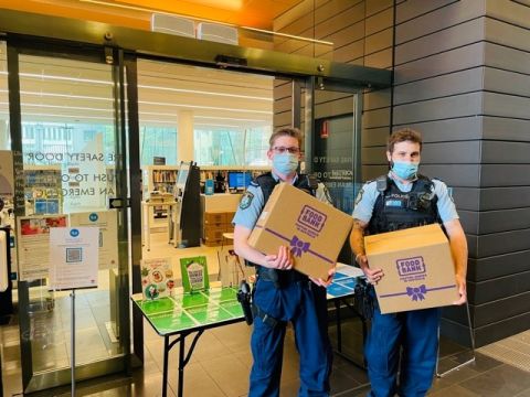 Sydney City Police collect Foodbank hampers from Surry Hills Library to deliver on resident wellbeing check-ins.