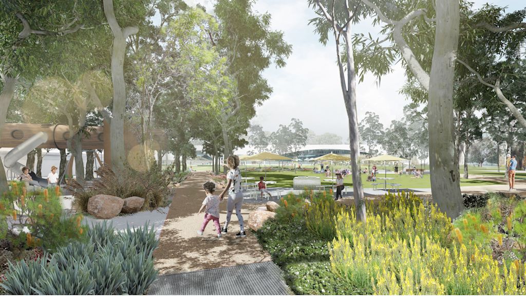 A lush park with several people is scattered around, featuring trees, plants, pathways, and a building in the background. A parent and child walk along one of the paths.