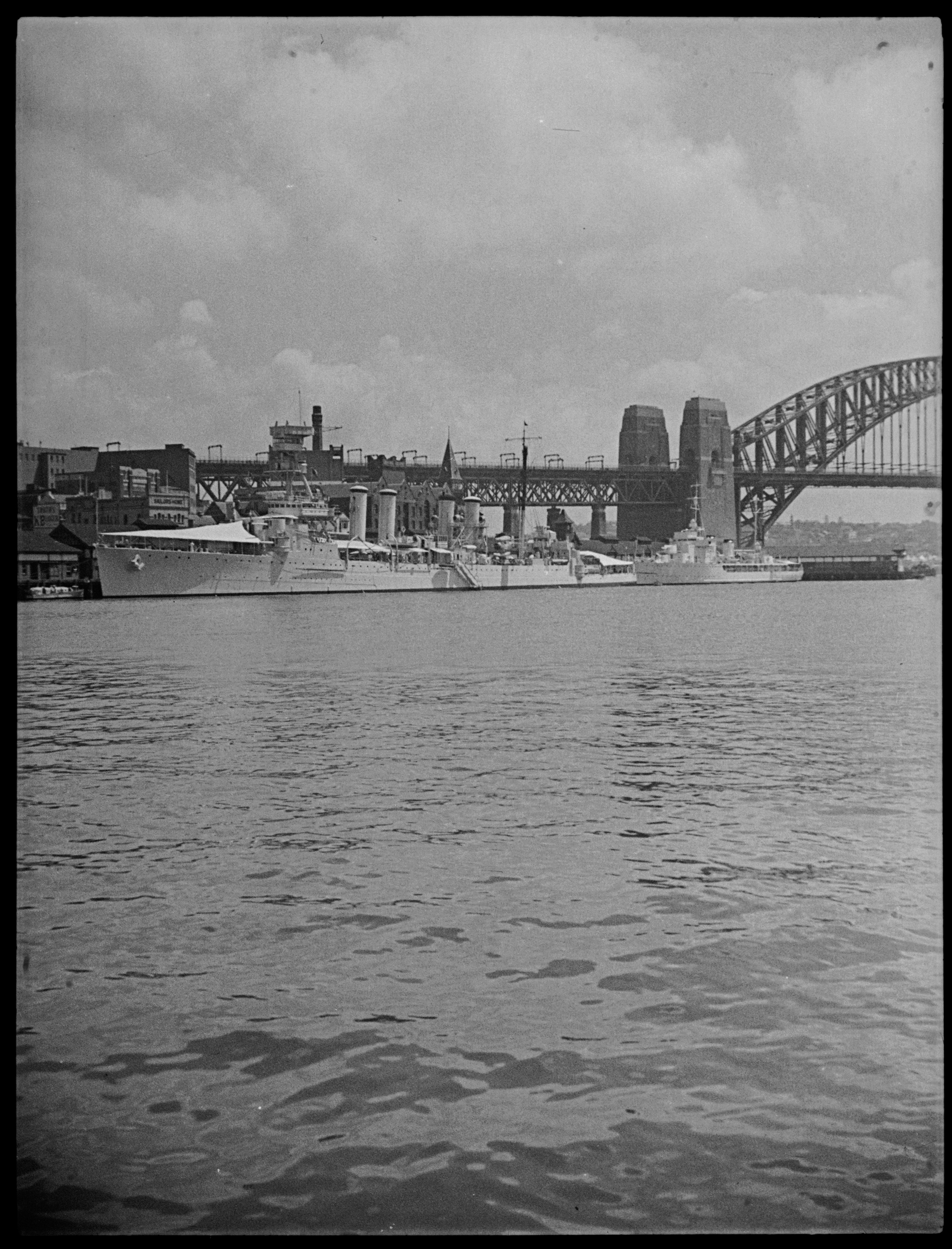 "He loved taking photos of the ships of Sydney harbour," said Bryant's grandson, Chris Lloyd. Taken from the wharves of Circular Quay, this photograph captures warships moored at The Rocks for the Sesquicentenary (150th anniversary) celebrations of first European settlement on 26 January 1938. Vessels visited from many nations. The ship at left is a United States Navy cruiser. Photo: Percy James Bryant / City of Sydney Archives A-01142002