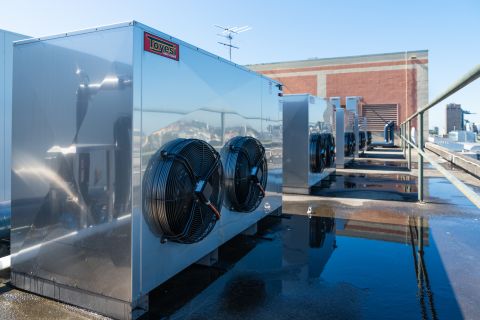 Heat pumps have replaced electric boilers, while heat exchangers capture heat from hot water pipes to warm the building&#39;s pool and spa. Photo: Nick Langley