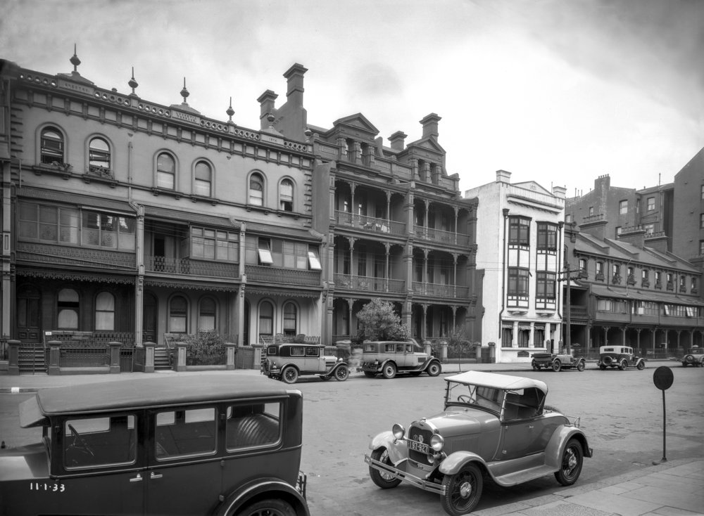 Terraced housing opposite Sydney Hospital, Macquarie Street, Sydney, 1933 (City of Sydney Archives, A-00006473)