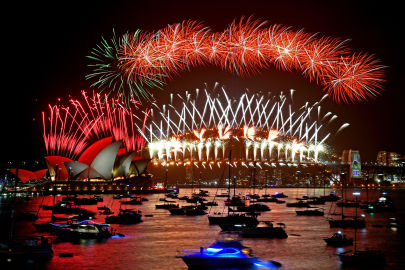 The midnight fireworks are seen from Mrs Macquarie's Chair during New Year's Eve celebrations in Sydney. Image: Mick Tsikas 