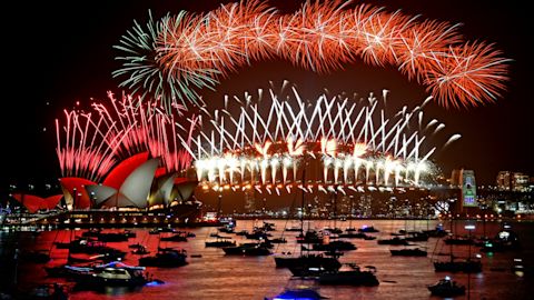 The midnight fireworks are seen from Mrs Macquarie's Chair during New Year's Eve celebrations in Sydney. Image: Mick Tsikas