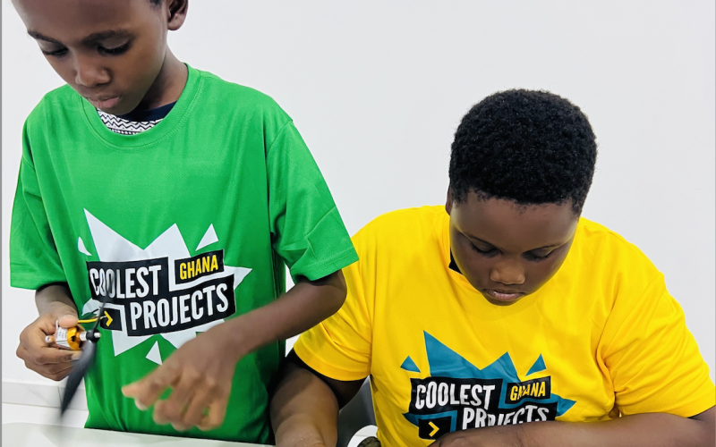 Two young people build a digital project .
