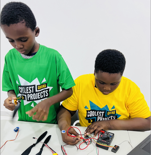 Two young people build a digital project .