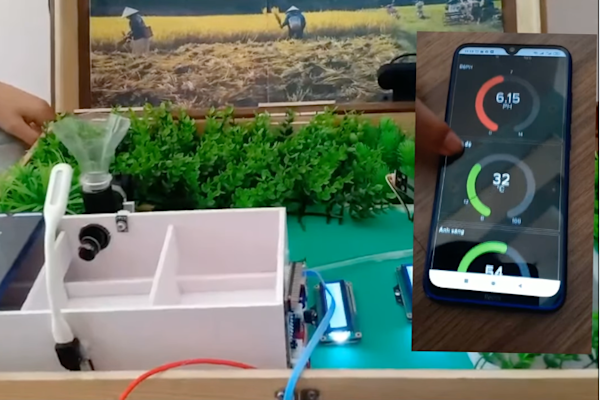 A young person's smart farm project, with a sensor, display screen and farm model