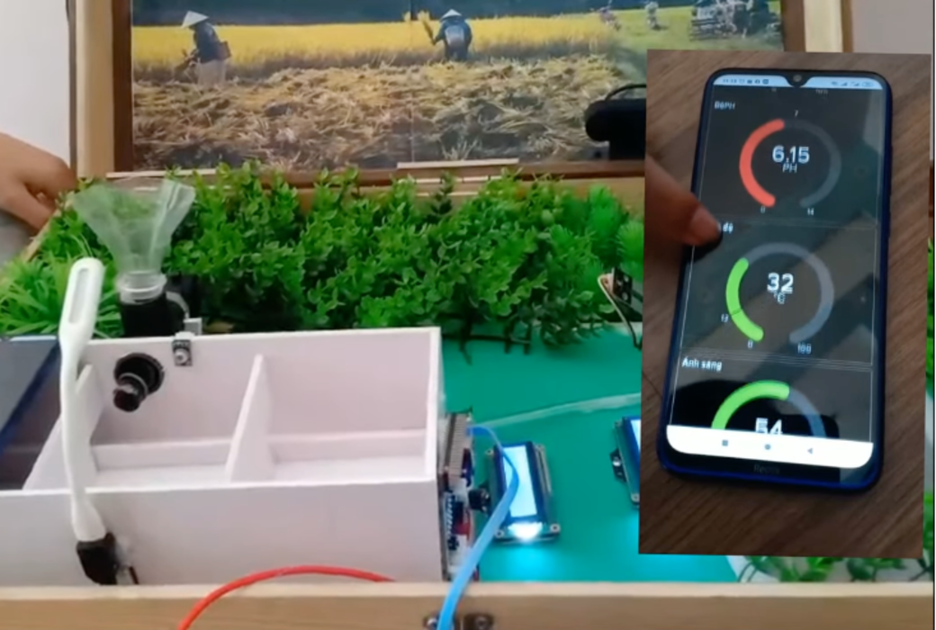 A young person's smart farm project, with a sensor, display screen and farm model