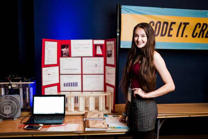 Female teen showcasing her coding project at Coolest Projects USA 