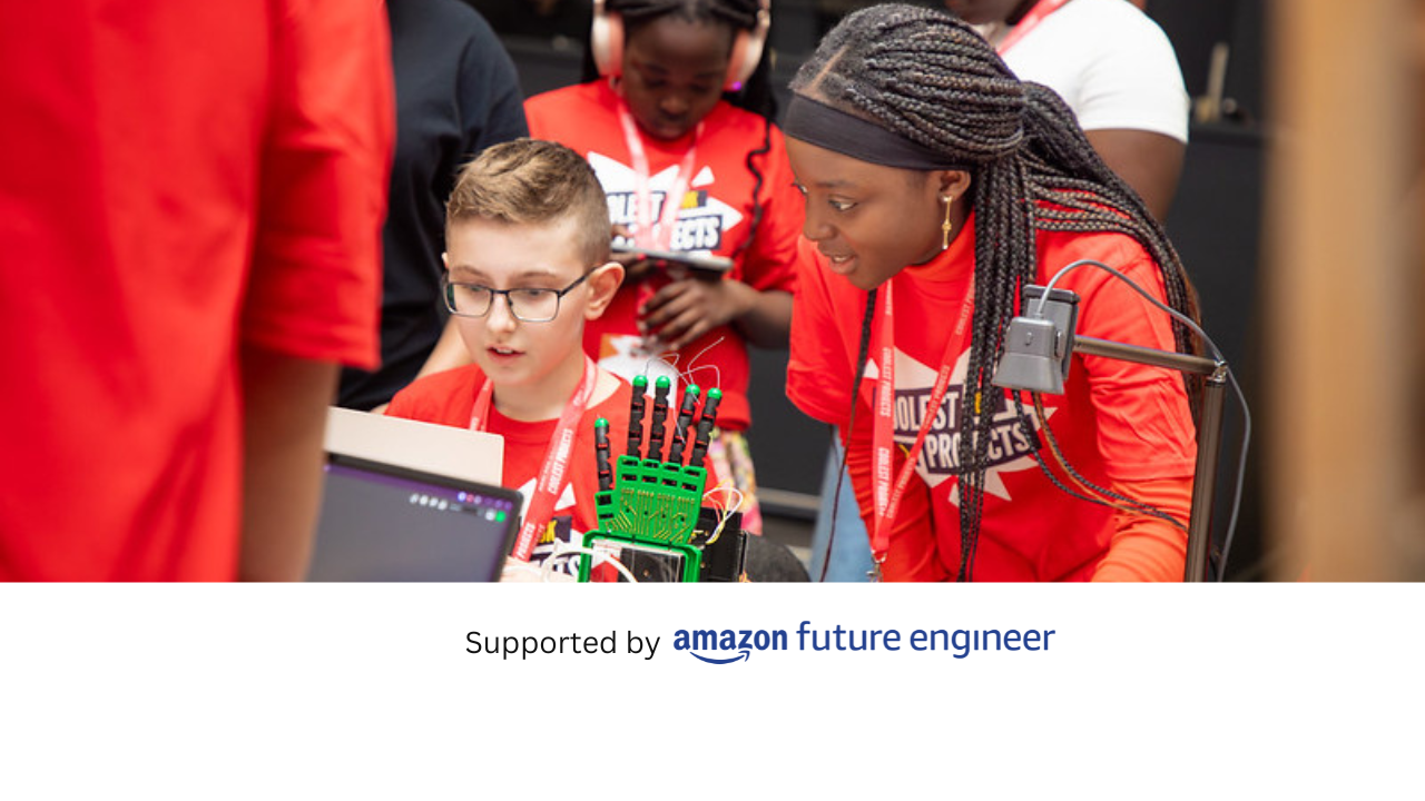 Young people look at a robotic hand project.