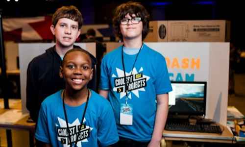 A Coolest Projects team standing by their project.