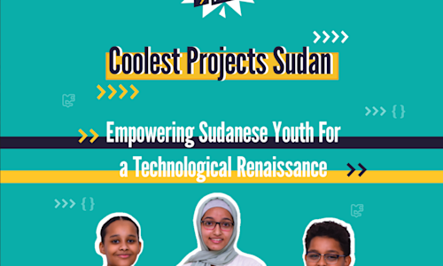 Two young women holding a Raspberry Pi computer and smiling.